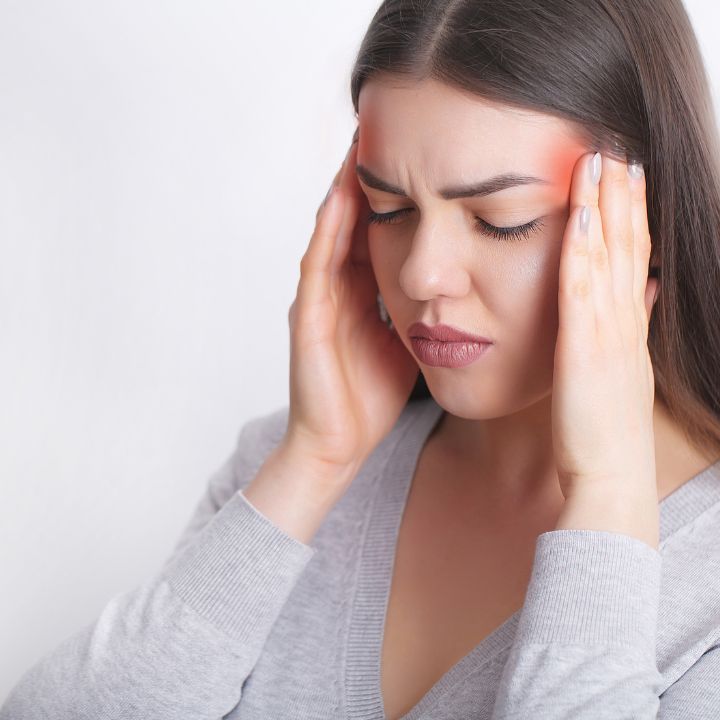 Woman with Migraine Symptoms